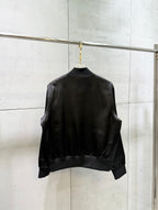 Black bomber jacket back with ribbed hem and cuffs