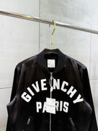 Black bomber jacket front with full zip, ribbed collar, and “GIVENCHY PARIS” print