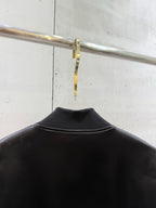 Black bomber jacket back with ribbed collar and smooth satin-like finish
