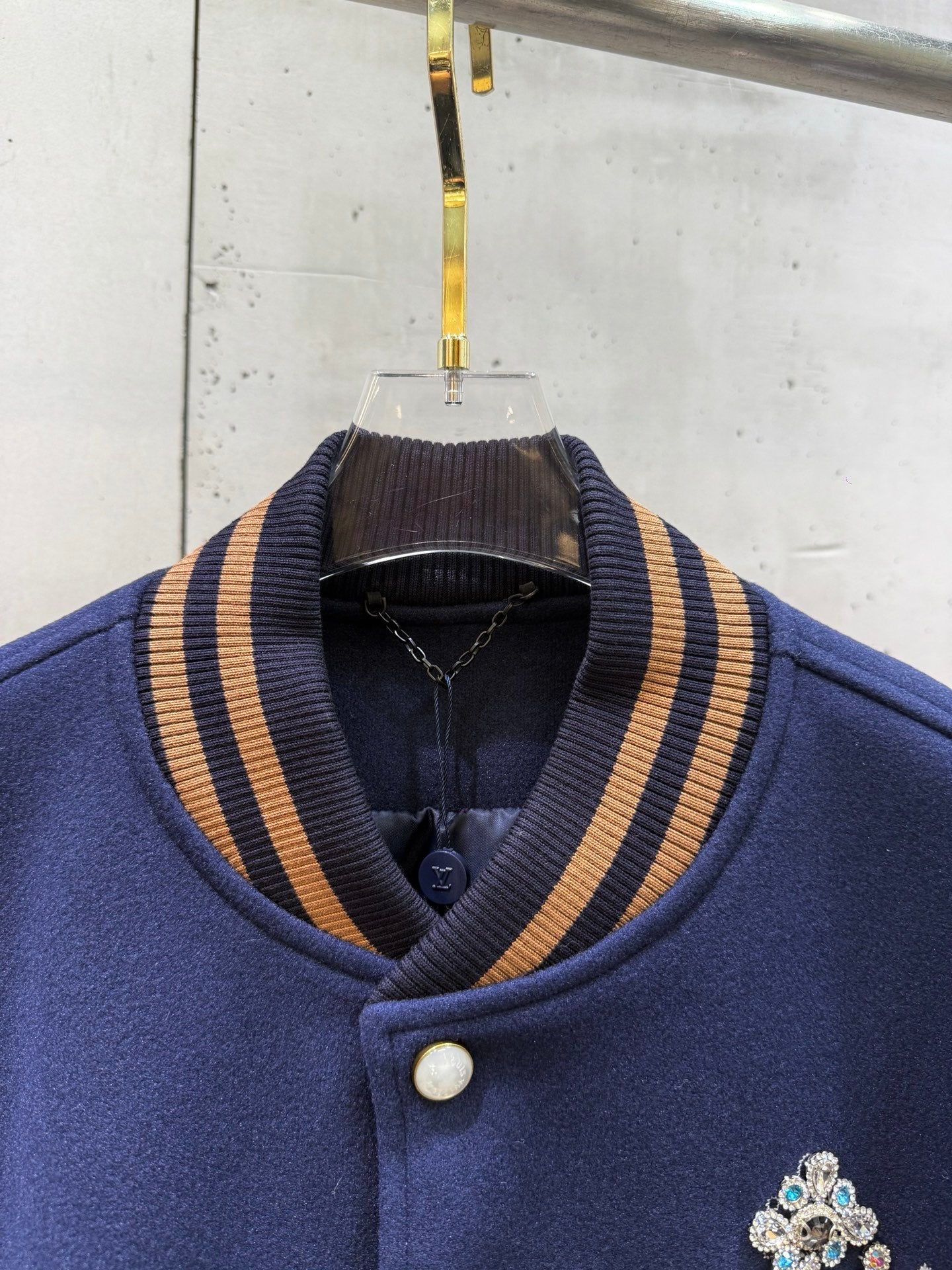 Louis Vuitton varsity jacket neckline with striped ribbed collar and buttons