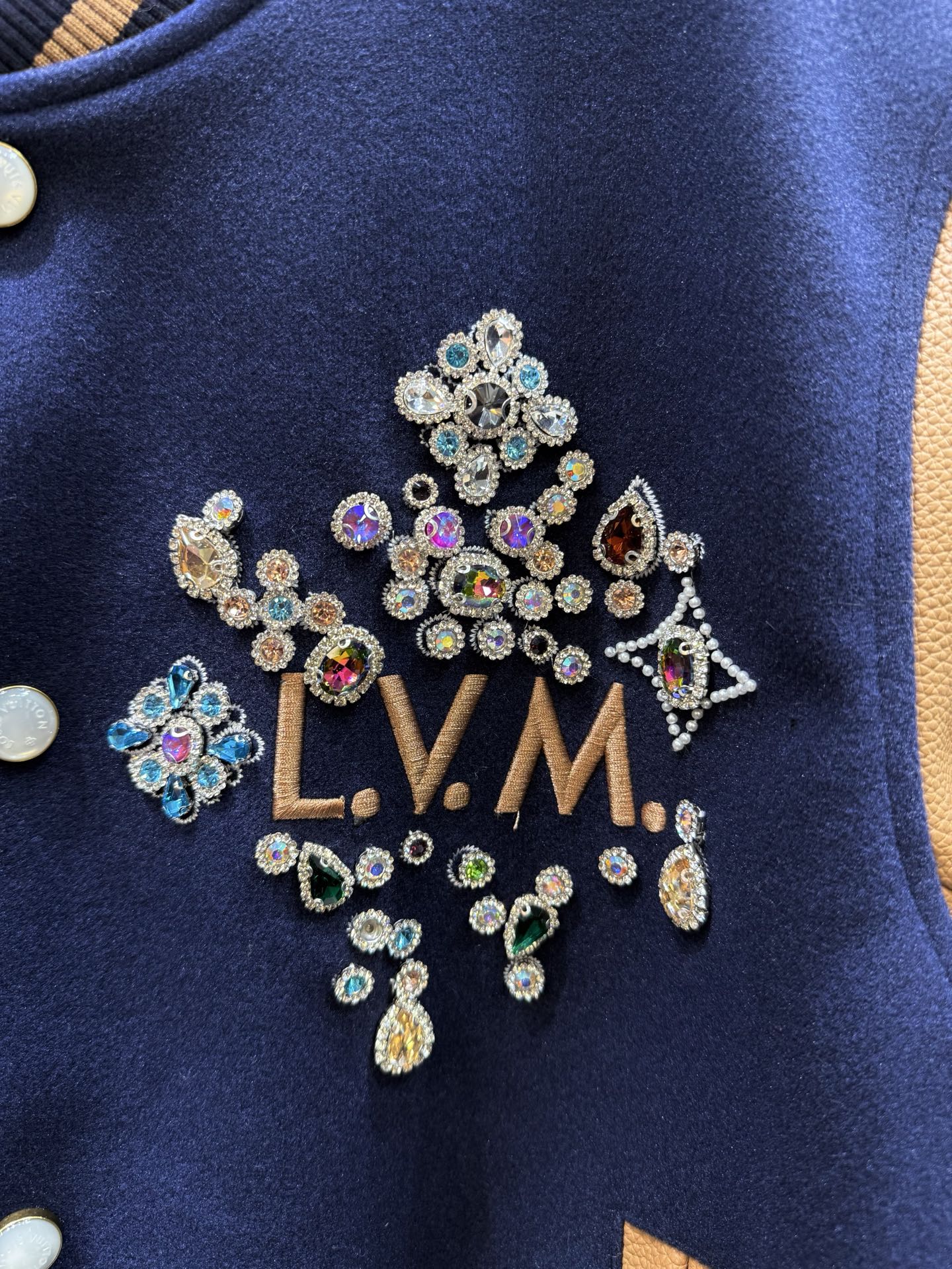 Jeweled LV logo applique on Louis Vuitton varsity jacket front