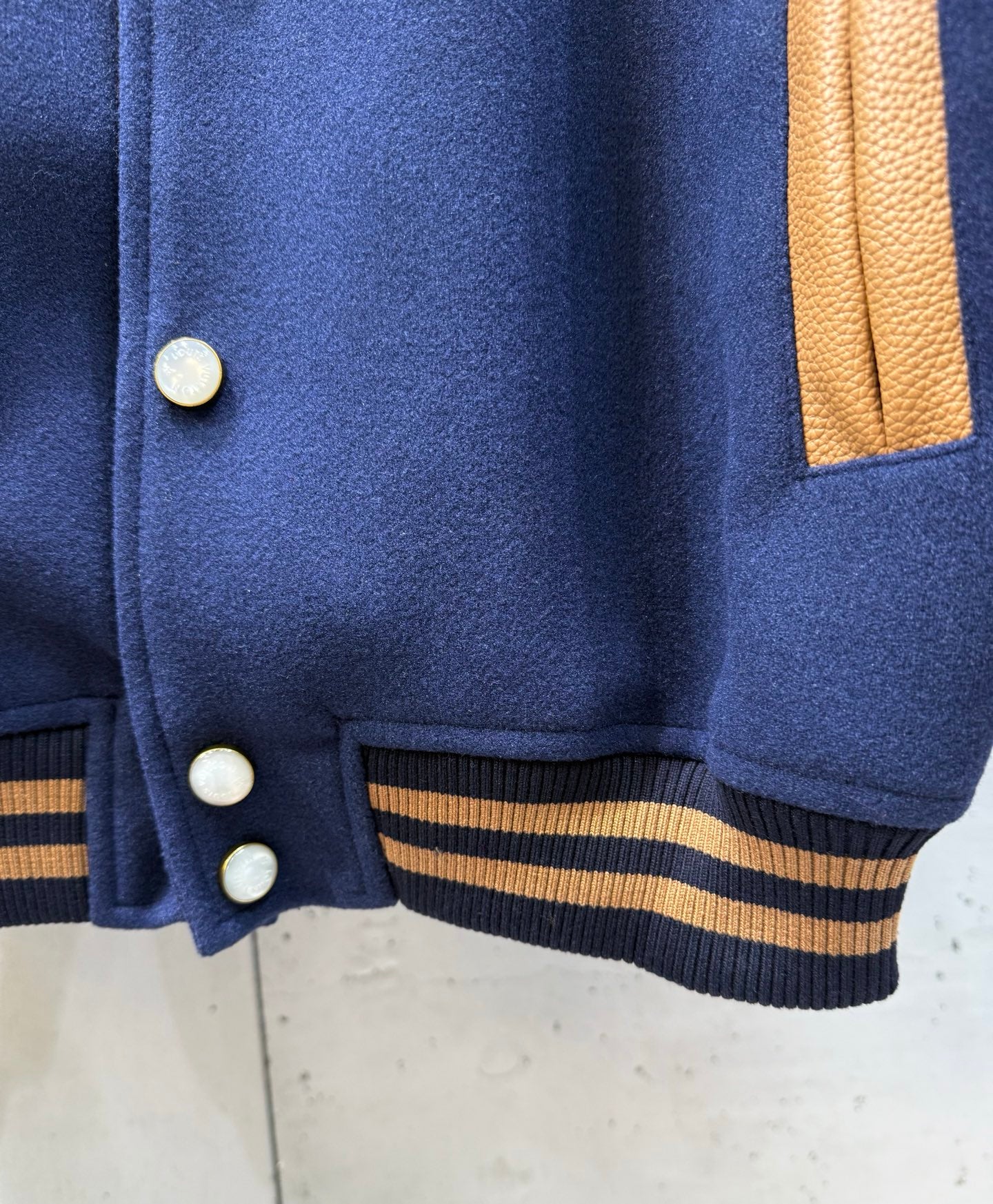 Louis Vuitton varsity jacket front hem with ribbed striped trim and buttons