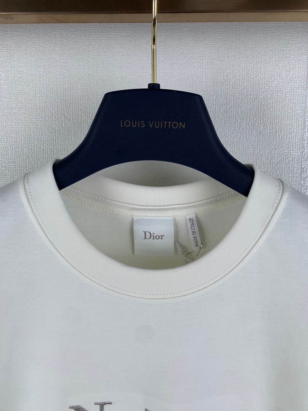 White T-shirt collar with interior tag under crew neckline