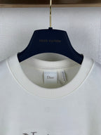 White T-shirt collar with interior tag under crew neckline