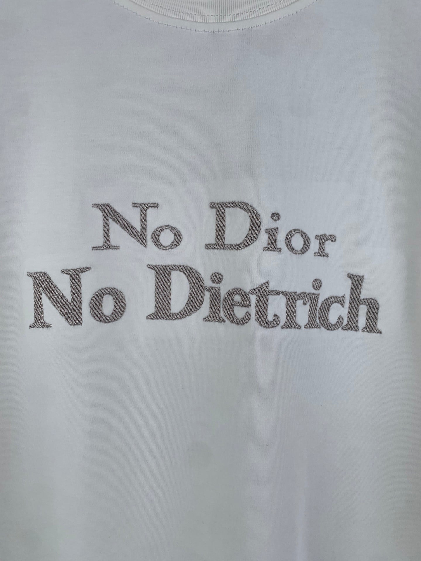 White T-shirt front with large 'No Dior No Dietrich' lettering print