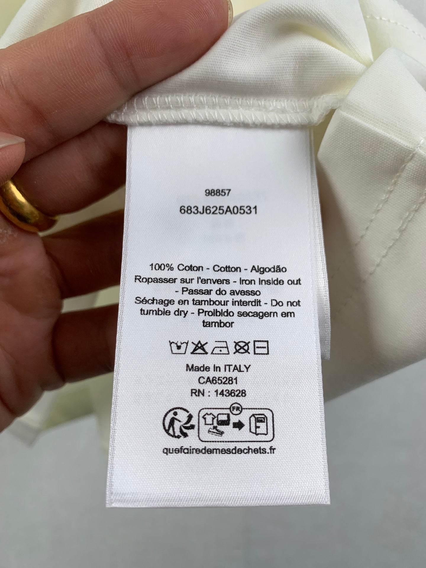 White T-shirt care label and size info, Made in Italy