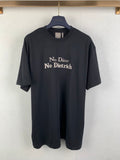 Dark gray crewneck T-shirt with front text “No Dior No Dietrich”