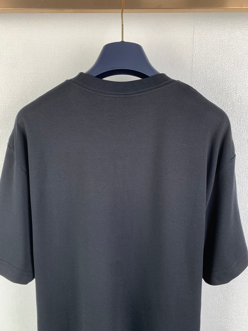 Dark gray crewneck T-shirt back view, plain