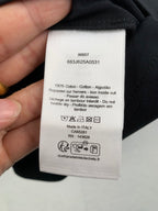 T-shirt care label with 100% cotton and size info, made in Italy