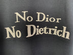 Dark gray T-shirt with large gold “No Dior No Dietrich” lettering