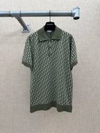Dark green short-sleeve polo shirt with logo-style repeat print