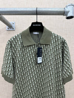 Dark green short-sleeve polo shirt with large repeat print and attached tag