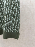 Dark green patterned polo sleeve with ribbed hem cuff