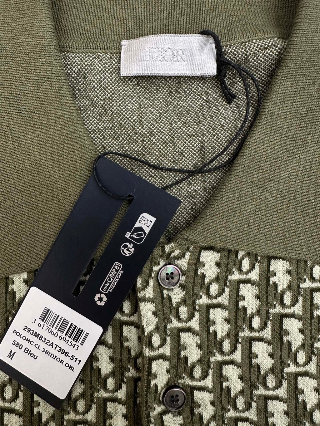 Olive short-sleeve polo collar with size and care tags