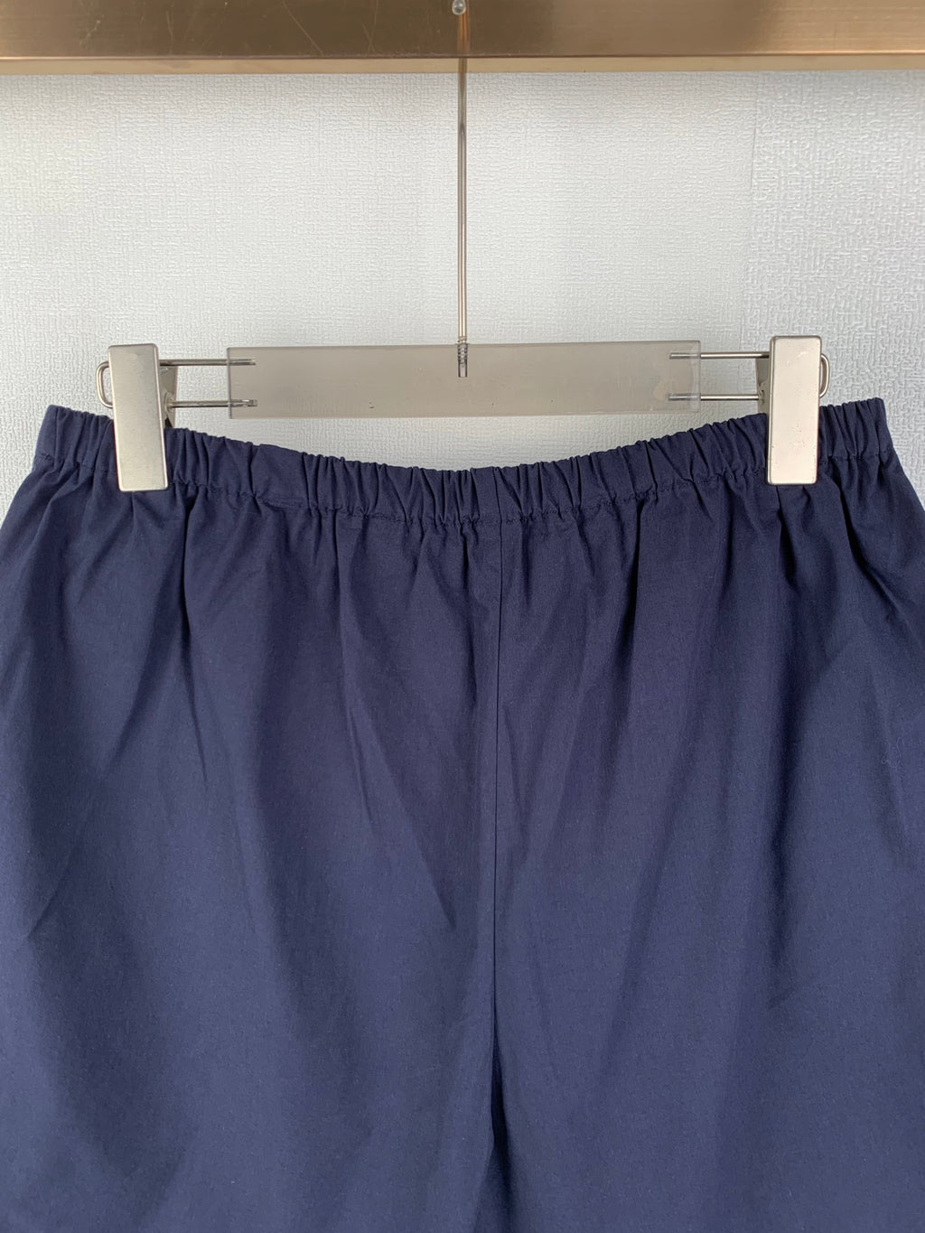 Navy Prada shorts with elastic waist and gathered front design