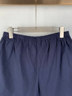 Navy Prada shorts with elastic waist and gathered front design