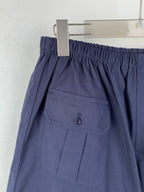 Navy Prada shorts with front pocket flap and button detail