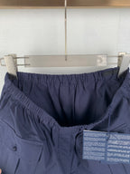 Navy Prada shorts with elastic waist and visible interior panel