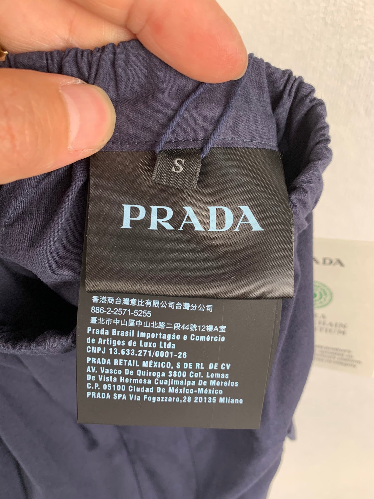 Prada shorts size S label and care tag with PRADA branding