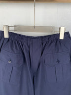Navy Prada shorts with elastic waistband and button cargo pockets
