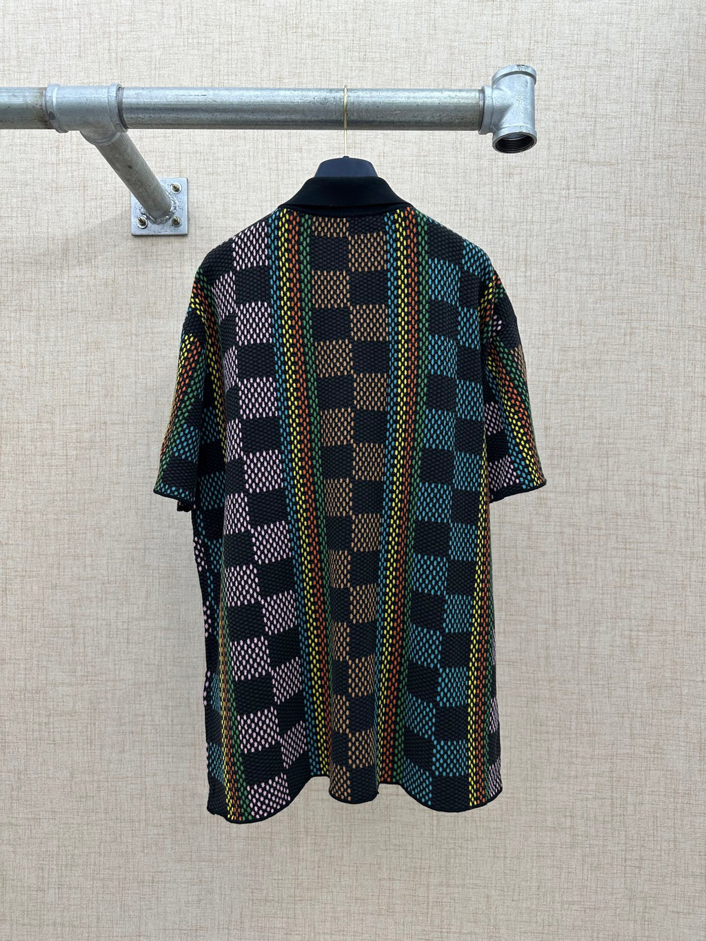 Dark multicolor checkered short-sleeve button-up shirt, back view