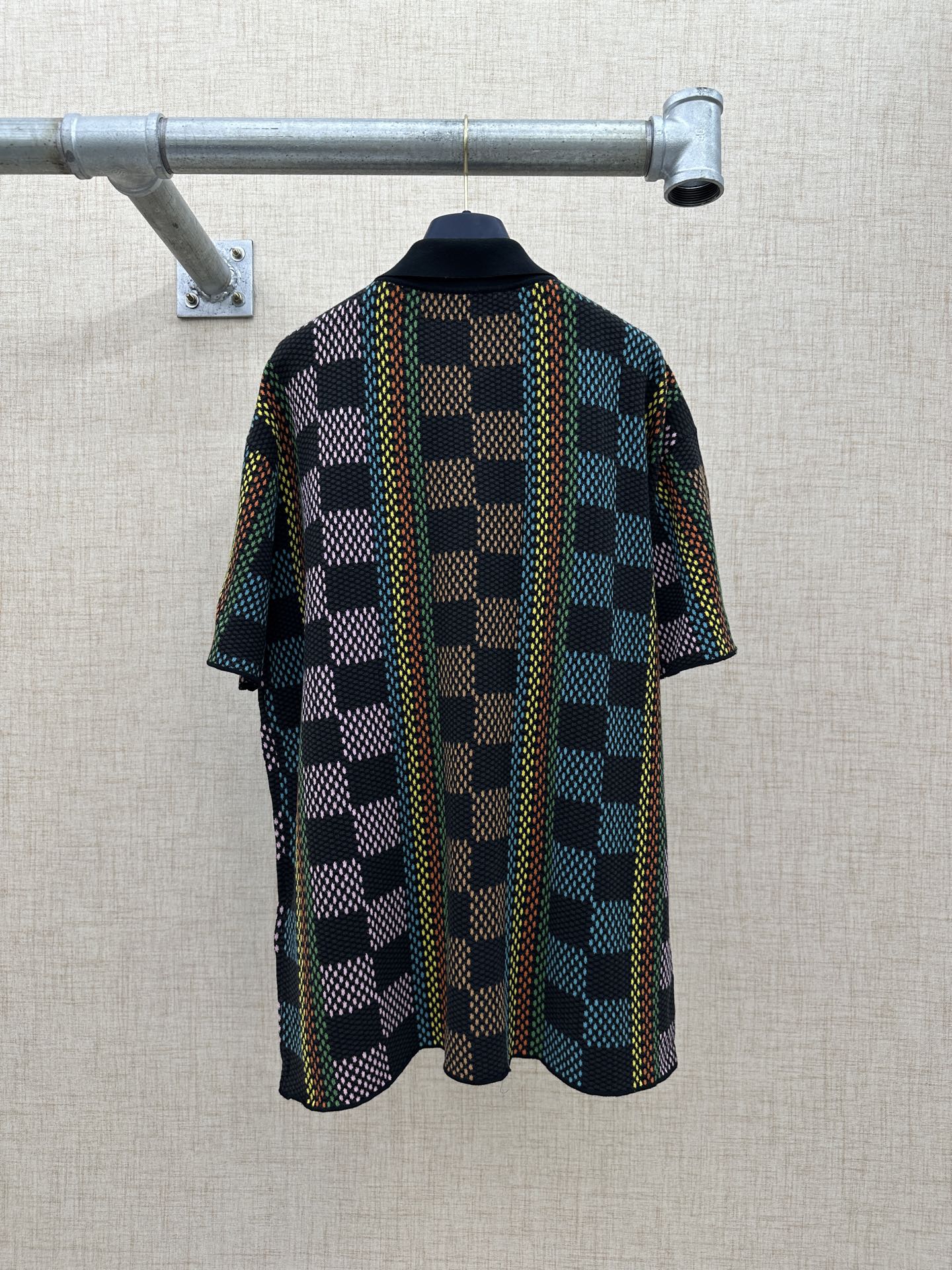 Dark multicolor checkered short-sleeve button-up shirt, back view