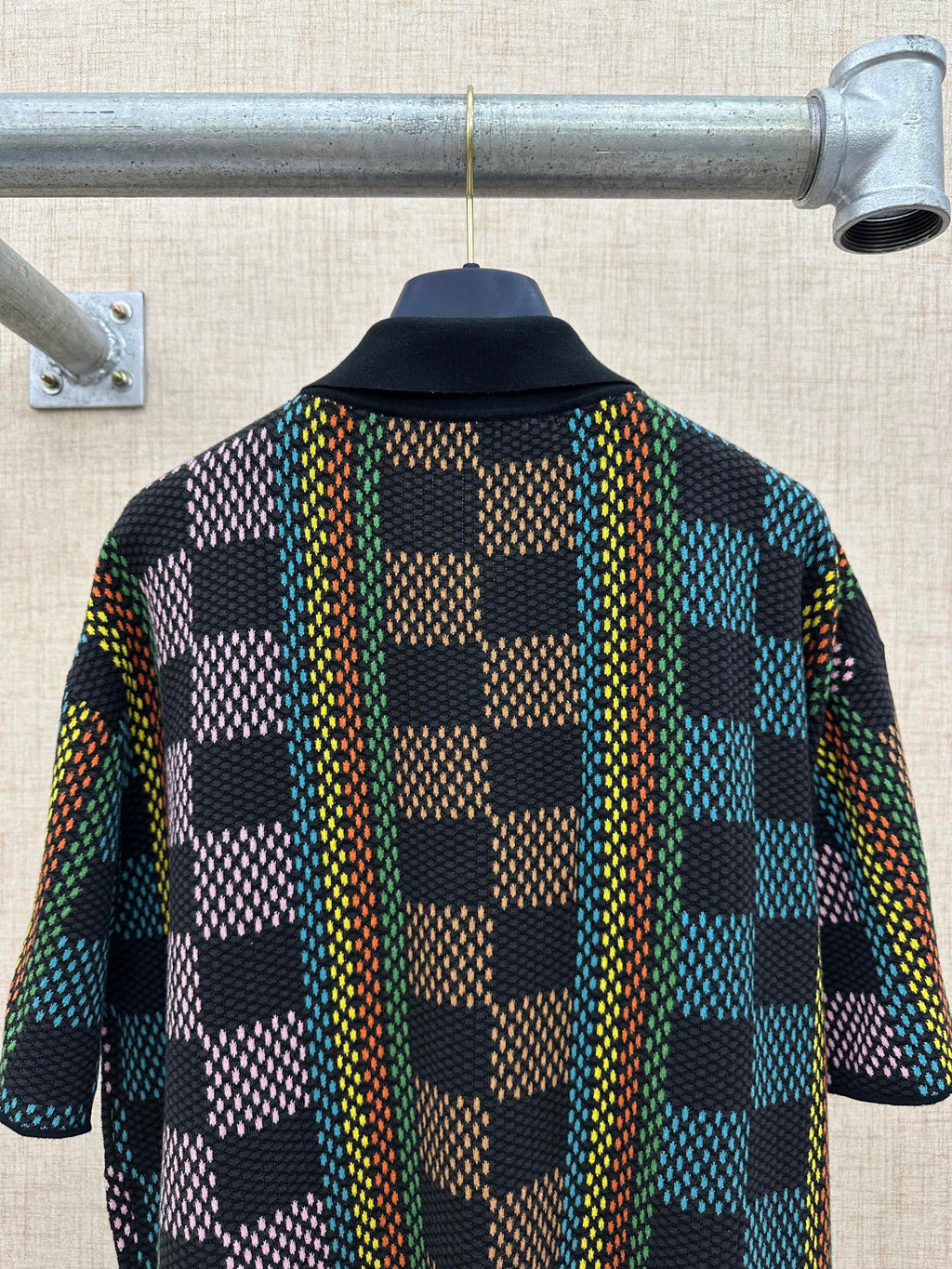 Dark multicolor checkered short-sleeve button-up shirt with collar, back view