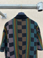 Dark multicolor checkered short-sleeve button-up shirt with collar, back view