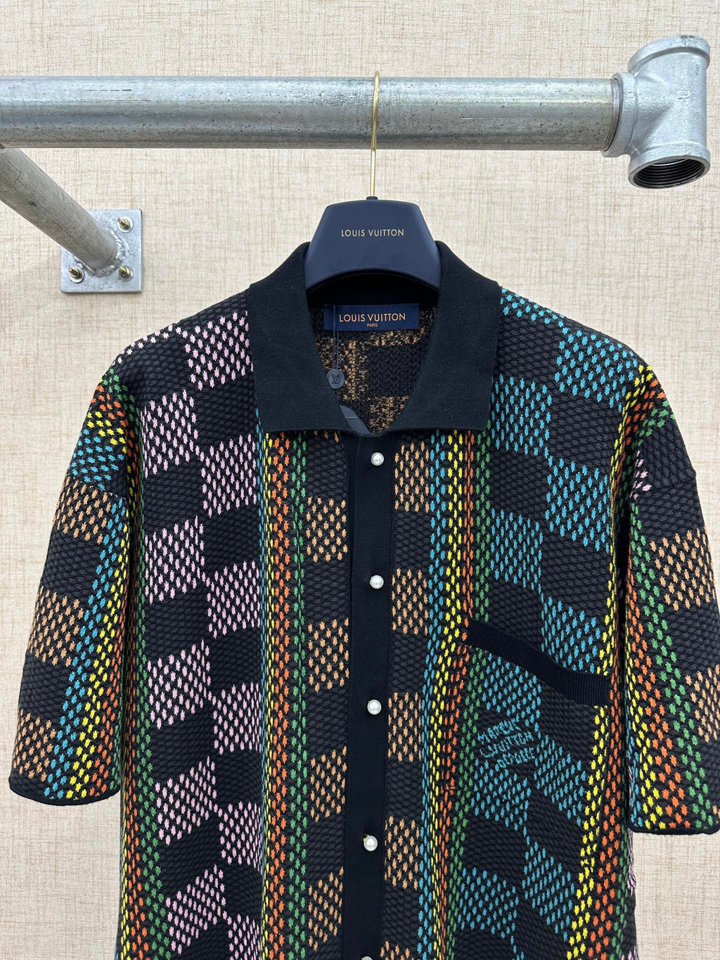 Dark multicolor checkered short-sleeve button-up shirt with collar and front buttons