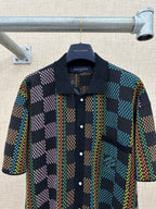 Dark multicolor checkered short-sleeve button-up shirt with collar and front buttons
