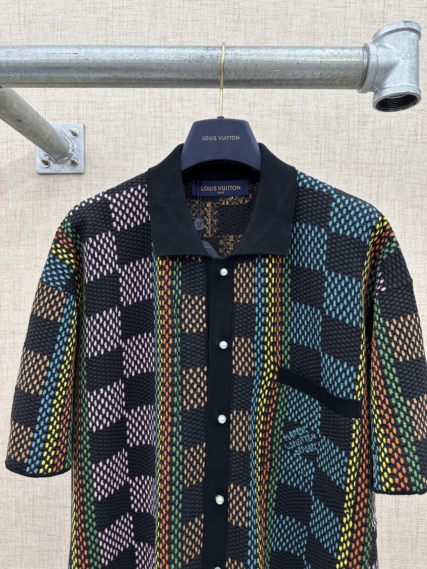 Dark multicolor checkered short-sleeve button-up shirt with collar and front buttons