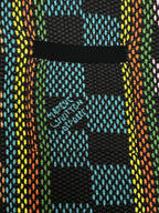 Multicolor checkered chest pocket detail on dark button-up shirt