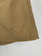 Olive shorts with stitched pocket flap detail on side seam