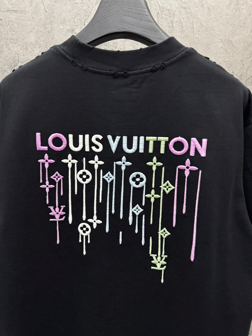 Black T-shirt with LOUIS VUITTON multicolor drip icon graphic on back
