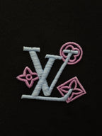 Embroidered LV-style logo in pink and white on black T-shirt