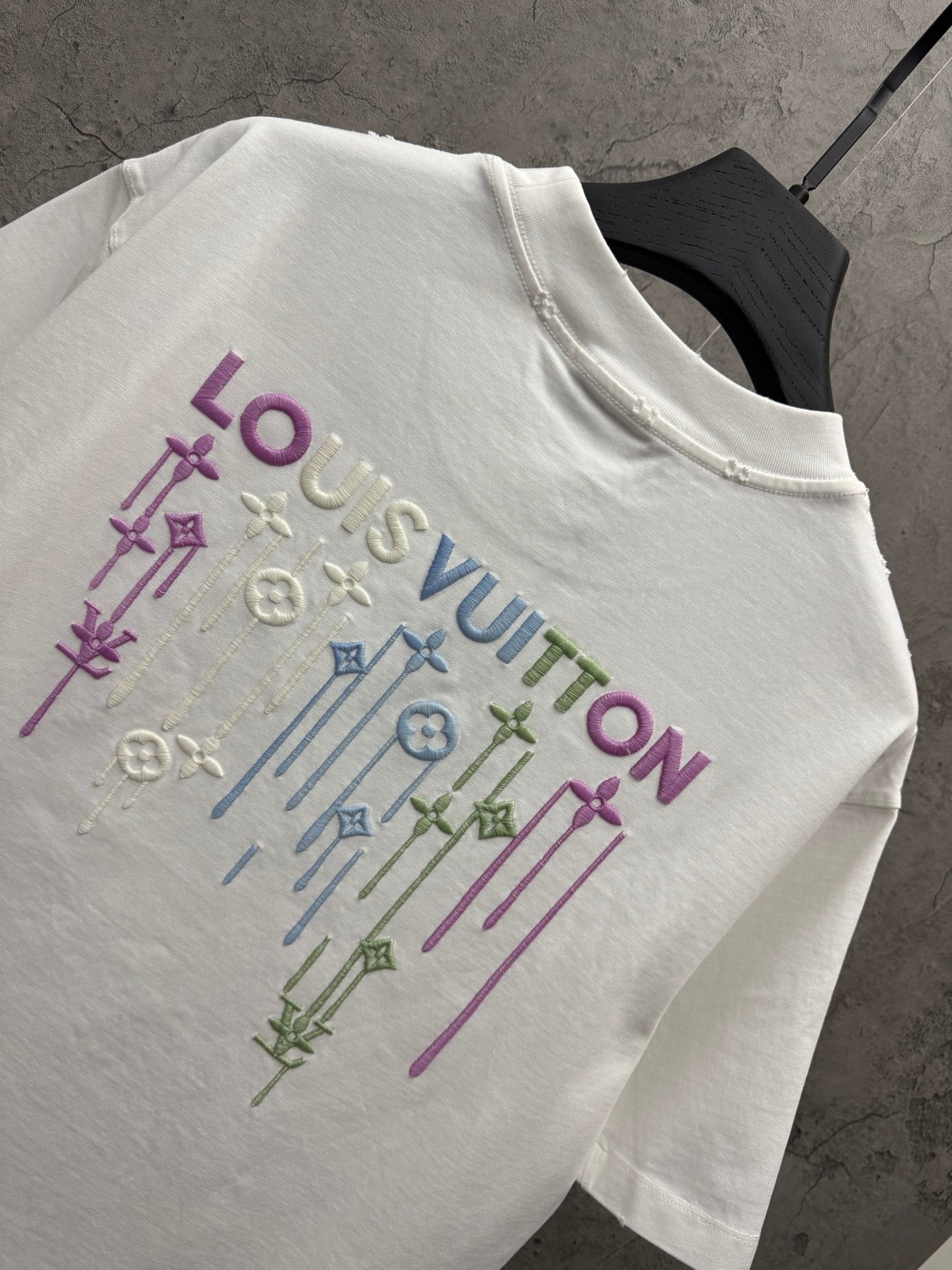 White T-shirt back with colorful Louis Vuitton sword-pattern embroidery