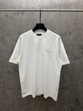 White short-sleeve T-shirt with small Louis Vuitton chest logo