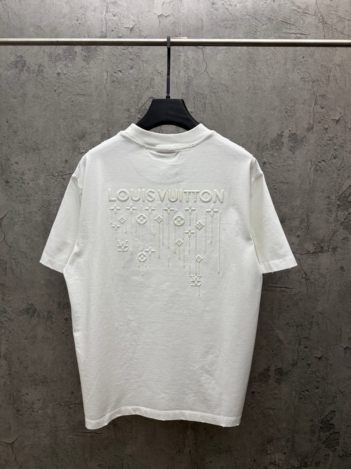 White short-sleeve T-shirt with large Louis Vuitton graphic on back