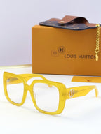 Louis Vuitton sunglasses, yellow frame, clear lenses, gold logo metal accents