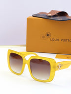 Louis Vuitton sunglasses, yellow frame, brown lenses, gold logo metal accents