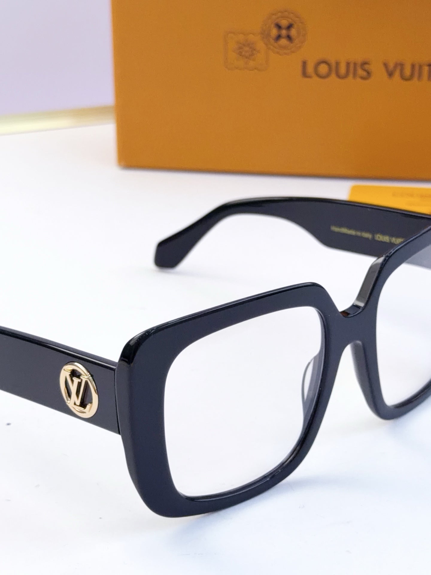 Louis Vuitton eyeglasses, navy frame, clear lenses, gold LV logo on temple