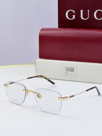 Gucci eyeglasses with clear lenses and metal frame, dark temples with multicolor stripe and gold-tone bridge