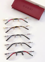 Gucci eyeglasses set of five frames with clear lenses and metal designs in black and gold tones