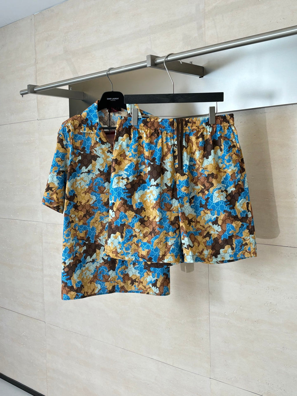 Gucci patterned shorts with elastic waistband, blue and brown all-over print.