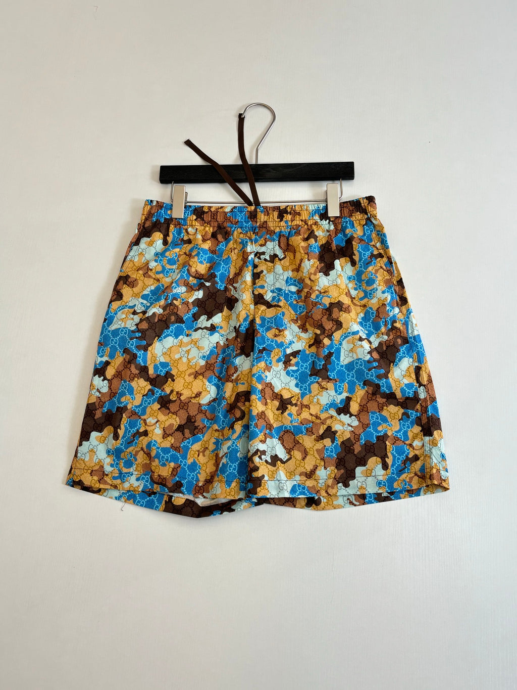 Gucci patterned shorts with elastic waistband, blue and brown all-over print.