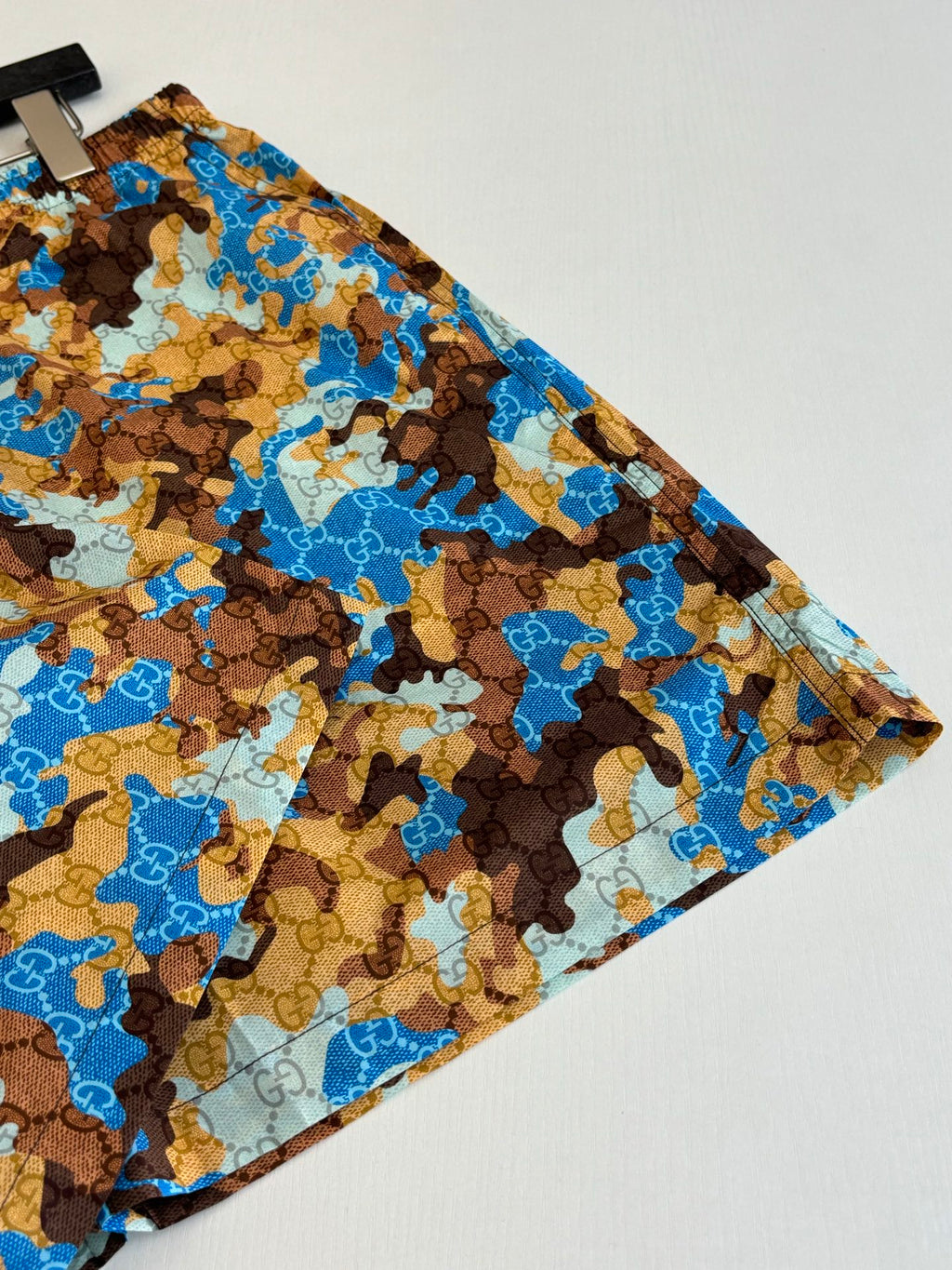 Gucci patterned shorts, blue and brown all-over print with gathered hem edge.