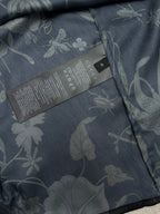 Long-sleeve button-up shirt interior care label with floral fabric
