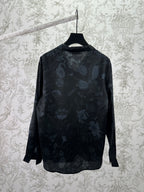 Long-sleeve button-up shirt, dark with allover light floral pattern