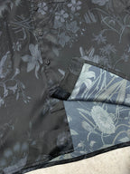 Long-sleeve button-up shirt cuff detail with floral print