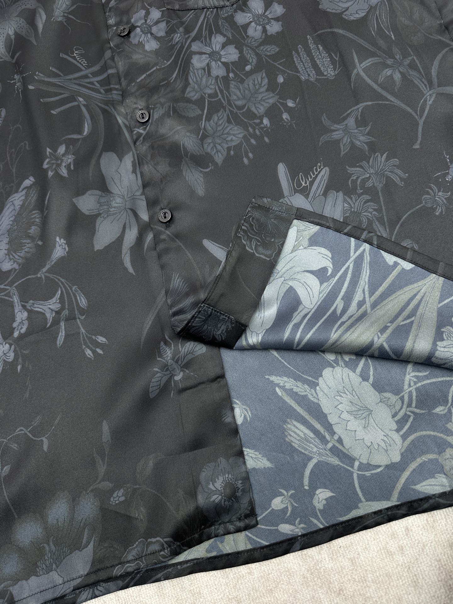 Long-sleeve button-up shirt cuff detail with floral print